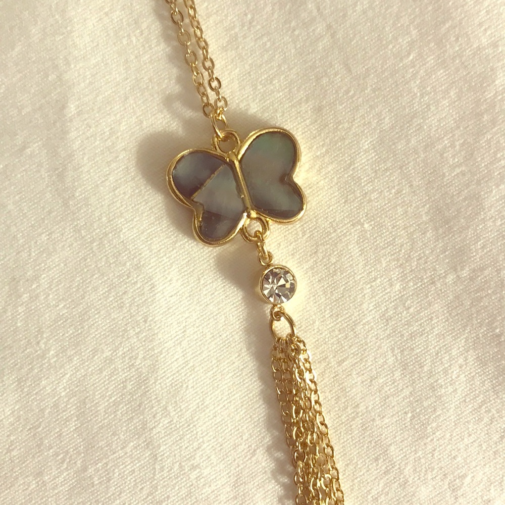 Pearly grey shell butterfly on gold chain